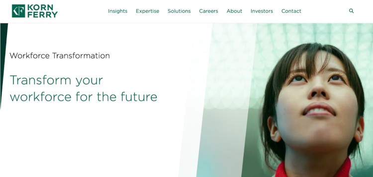 Korn Ferry promotional banner showing a young professional looking upward with the message "Transform your workforce for the future," highlighting how they help their clients with workforce transformation.