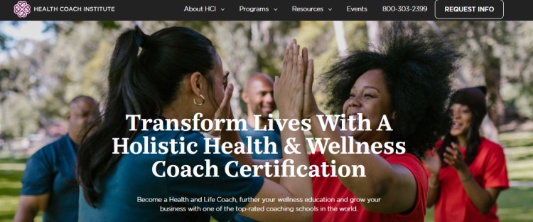 Group of people outdoors celebrating and high-fiving, representing the Health Coach Institute’s program to become a certified health and wellness coach.