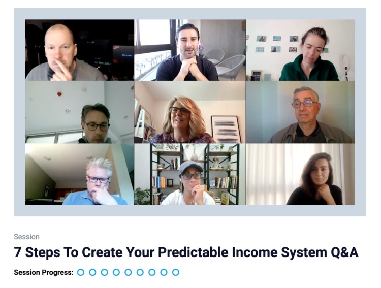 Liam Austin leading a live group training Q&A session titled 7 Steps To Create Your Predictable Income System with multiple coaching participants on screen.