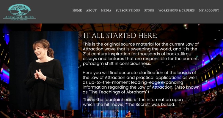 Coach speaking on stage about how to achieve transformation through the Law of Attraction.