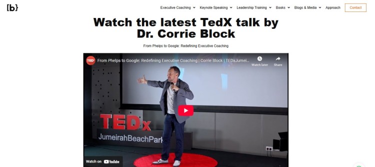 Executive coaching expert Dr. Corrie Block delivering a TEDx talk on leadership and redefining executive coaching on stage.