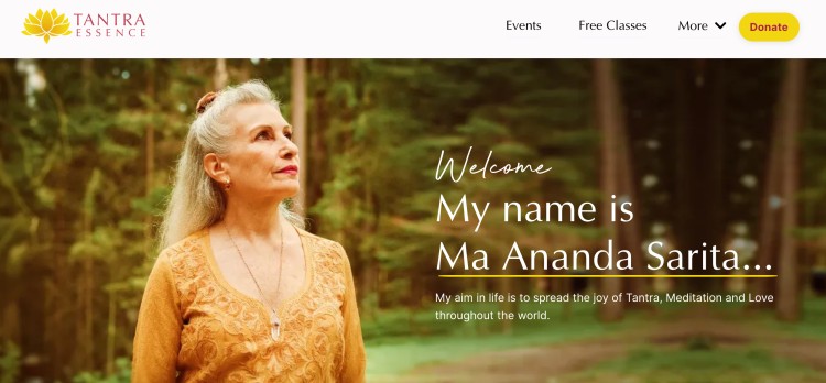 Tantra teacher Ma Ananda Sarita standing outdoors, welcoming visitors to her Tantra Essence website and sharing her mission of tantra, meditation, and love.
