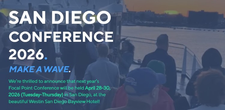 Crowd attending a local coaching conference in San Diego with event details displayed on screen
